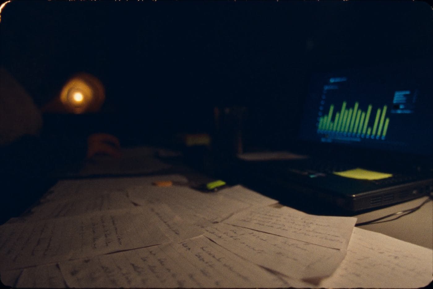 Study notes and a chart on a desk at night